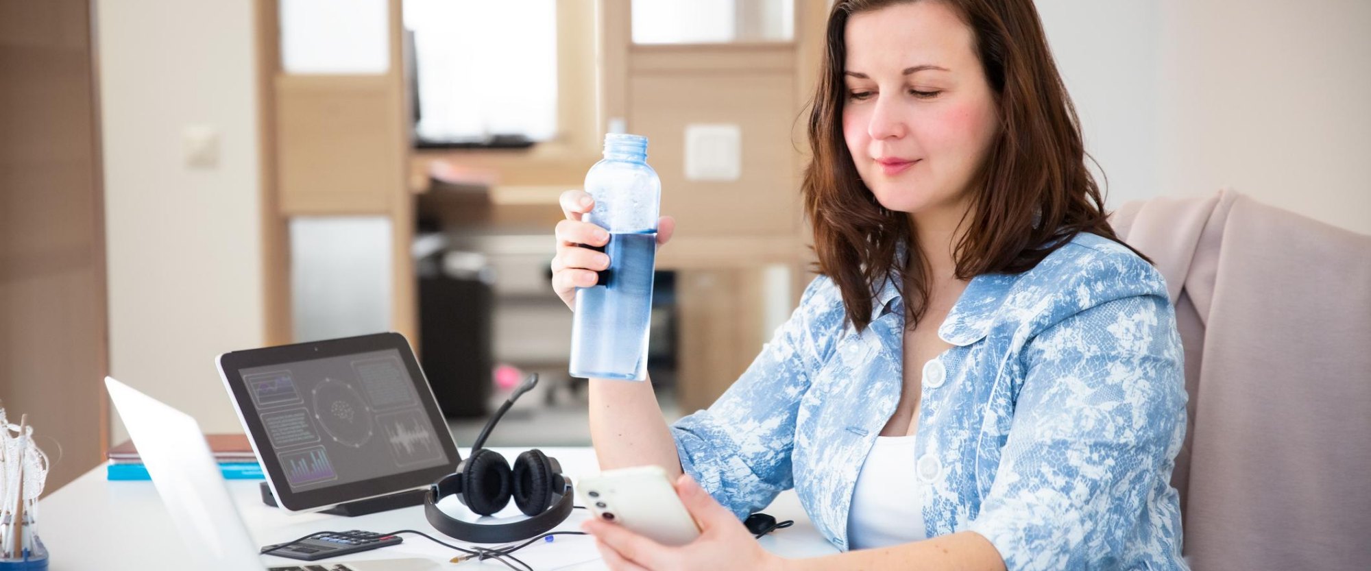 Person at a desk reviewing the bottle app